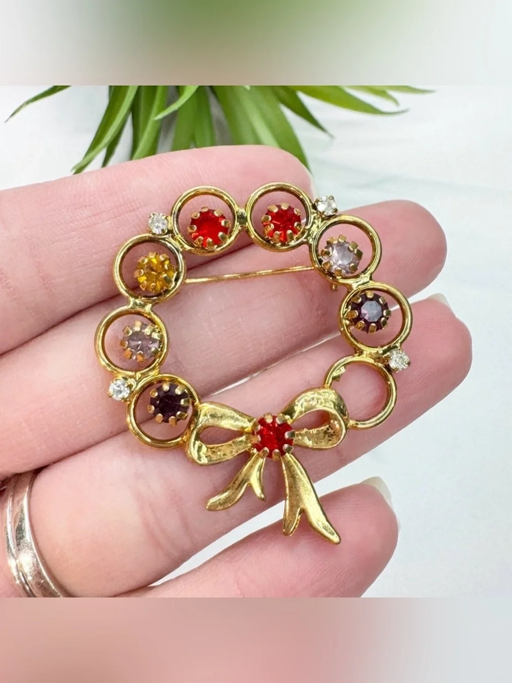 Vintage 60s Multicolor Rhinestone Open Circle Ring Ribbon Bow Gold Tone Brooch